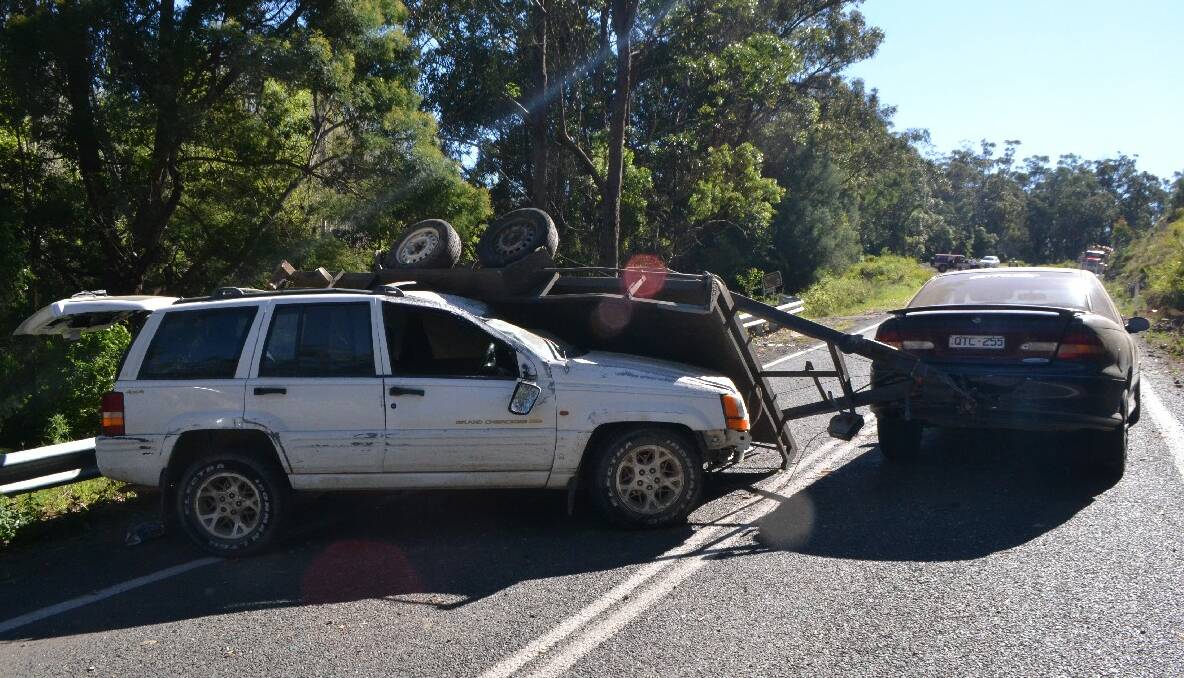 ACCIDENT SCENE: A single-vehicle accident near Tilba Tilba closed the Princes Highway on Friday morning. Swipe or click through for another photo. 