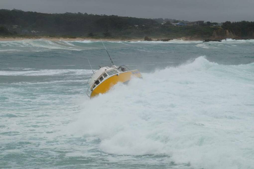 ROUGH SEAS: Still photos of the charter boat that nearly capsizes coming into Bermagui Harbour on Monday.