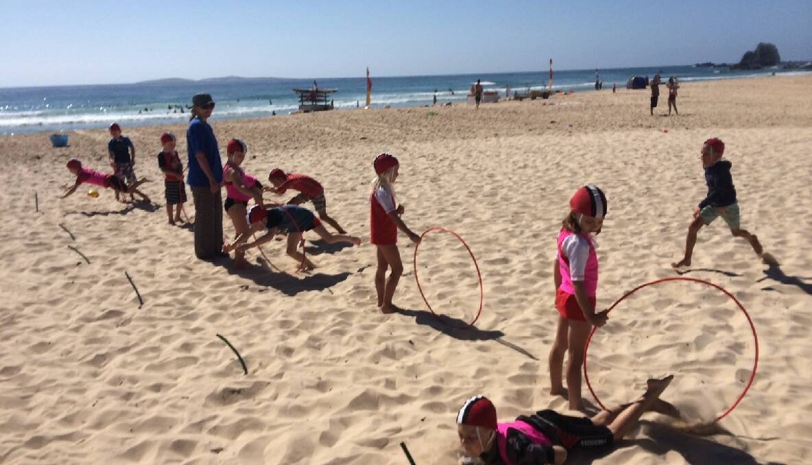 NIPPERS TRAINING: Narooma Nippers learn how to do flags on Narooma surf beach on Sunday.