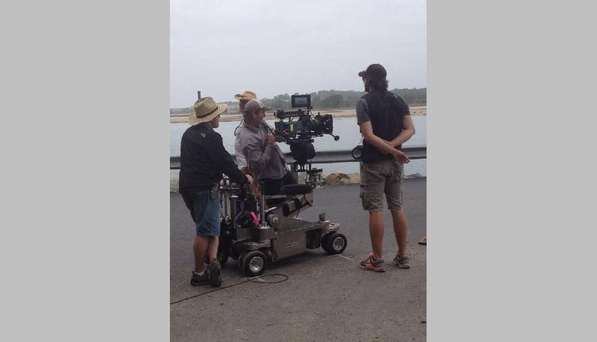 A TEAM of film production people, extras and classic vehicles descended on Wallaga Lake bridge on Tuesday to film a scene for Angelina Jolie directed movie “Unbroken”.